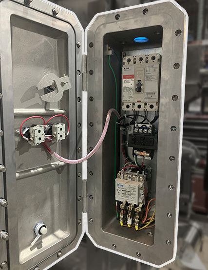 Open view of a UL-certified 698A NRBX control panel, revealing internal components, used in industrial food and beverage manufacturing. Designed by Apex Industrial Automation.